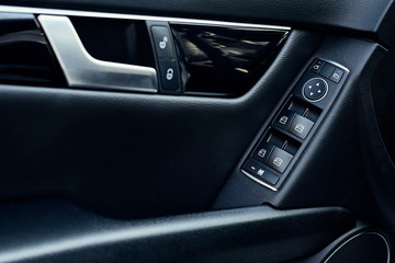 Obraz na płótnie Canvas Automatic control panel of car windows close up