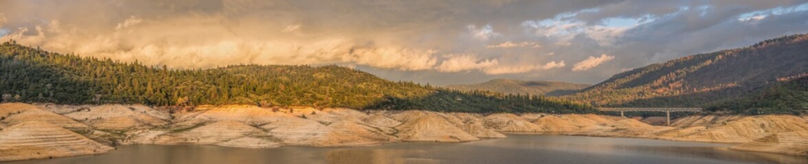 Panoramic landscape of storm clouds passing over Lake Oroville in Northern California after a drought that caused low water.