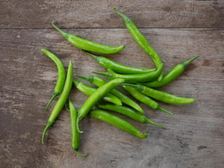green chili pepper on wood background