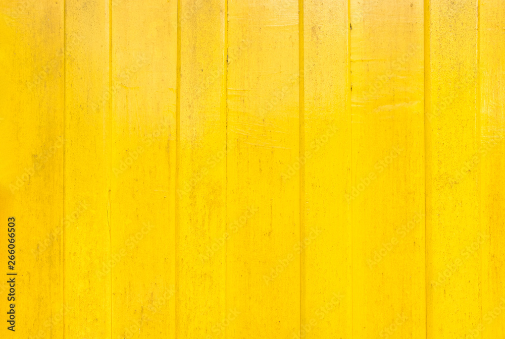 Wall mural yellow paint wood wall texture background.vivid color for summer backdrop