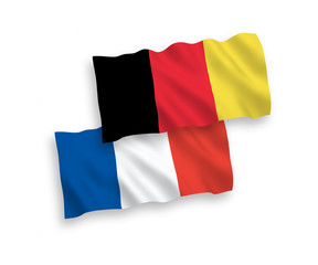 National vector fabric wave flags of France and Belgium isolated on white background. 1 to 2 proportion.