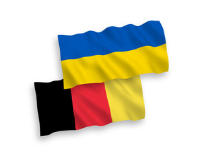 National vector fabric wave flags of Belgium and Ukraine isolated on white background. 1 to 2 proportion.