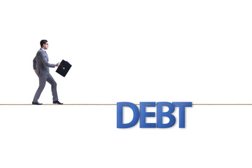 Fototapeta premium Debt and loan concept with businessman walking on tight rope