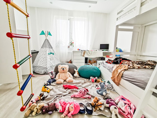Interior.children's playroom without children full of toys in a mess scattered around the room colorful