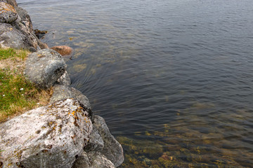 The flow of water. Sea water flows under the stone bridge