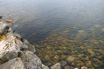 The flow of water. Sea water flows under the stone bridge