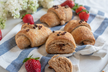 Homemade fresh golden croissants with chocolate filling