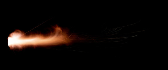 Texture of firearm shot with bright flash of light, sparks, smoke and gunpowder gases on black background - 266072388