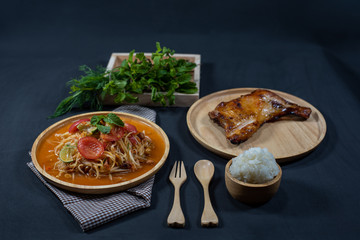 papaya salad on dish stick rice and grilled chicken, Thailand Food