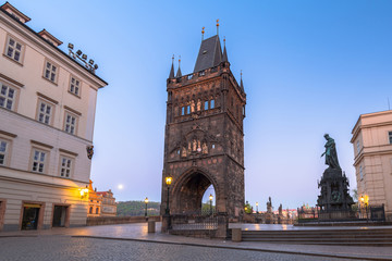 Fototapeta na wymiar Tower of the Charles bridge in Prague at dawn, Czech Republic