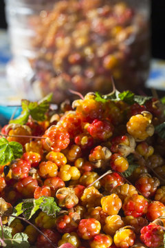 Сloudberriy berries in the spoon on the stone