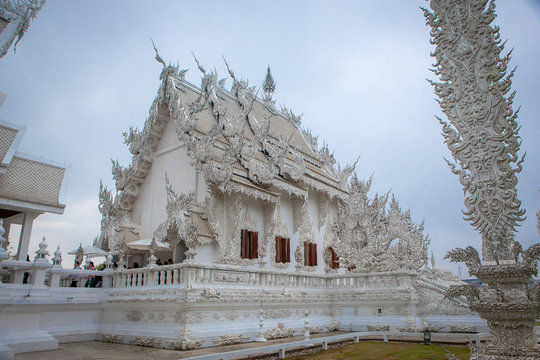 Wat Rong Khun - The White Temple - on a cloudy day. Chiang Rai, Northern Thailand
