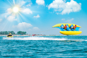 Young people on water attractions during summer vacations. Summer 2019. Welcome to active vacation