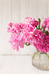 Pink peonies bouquet on white background