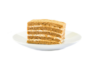 piece of cake in a plate on a white background