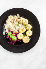 Chicken salad with potatoes, restaurant serving portion