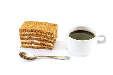 piece of cake and a cup of coffee on a white background