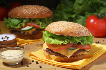 Two fresh hamburgers with vegetables