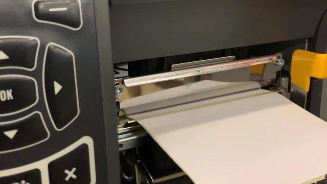 Close up of customized printer labels in slow motion
