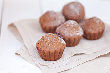 Chocolate muffin on white plate