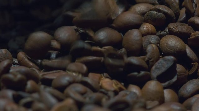 Macro shot of coffee beans tumbling down