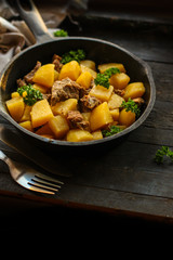 goulash, stewed potatoes with meat. stewed main course. food background. top