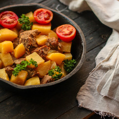 goulash, stewed potatoes with meat. stewed main course. food background. top