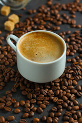 coffee freshly brewed in a white cup serving of beverage (coffee grain). food. top.copy save