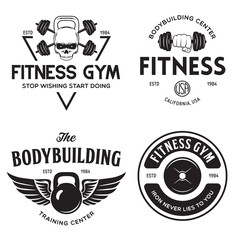 Set of monochrome fitness emblems, labels, badges and designed elements. Vintage bodybuilding logo templates.