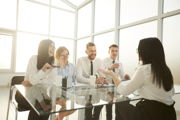young employee of the company , answers questions during the interview.