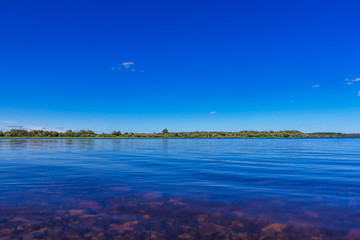 view of the kama river on a cloudless summer day