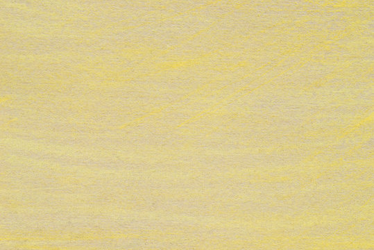 yellow pastel drawing on recycled paper background texture