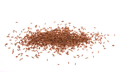 Closeup view of a pile of caraway. Spilled spices isolated on white