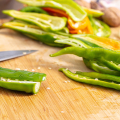 cook cutting hot peppers