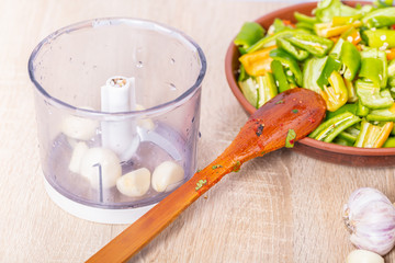 garlic blender bowl and a plate of green pepper