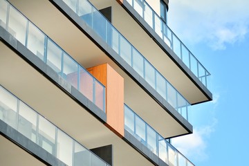 Apartment building with blue sky and clouds