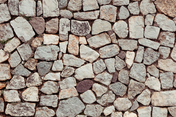 Rustic vintage wall of uneven stones