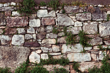 Rustic stone wall made of different stones