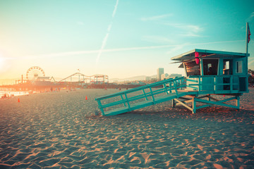 Iconic Santa Monica rescue cabin against famous amusement park in sunset