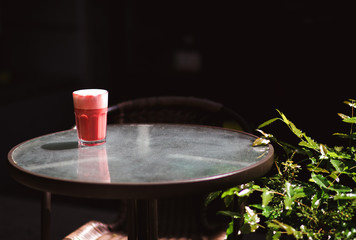 Pink, strawberry, sweet cappuccino on the white background with sticky notes on the wall.