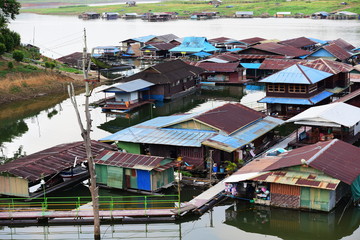 Fototapeta na wymiar Community and residential views And the way of life of people Along the lake in a large dam at Sangkhla Buri District, Kanchanaburi Province, Thailand