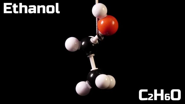 Ethanol C2H6O molecule rotating on black background