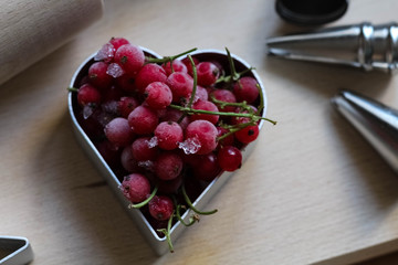 Steps of making biscuits. Frozen berries, red currant. Concept of festive baking. Mother's Day, Women's Day, Valentine's Day