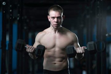 Fototapeta na wymiar Athletic Shirtless Man Showing Well Trained Body.