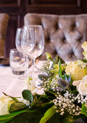 Flowers and Wine Glasses on a Table Set-up