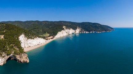 Naklejka na ściany i meble Aerial view of high white cliffs of Vignanotica beach in Apulia region, Italy