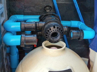 Filling sand into sand filter.Service and maintenance of the pool.Black wash filter tank of the...