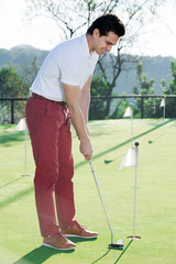 Fototapeta premium Male golfer at golf course