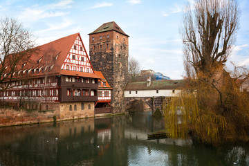 Fototapeta na wymiar Nuremberg, Hangman's House, Bridge over the Pegnitz River and Water tower, Germany