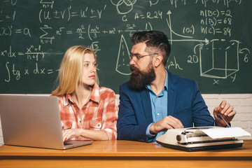 Teacher respects students. Science and education concept. Tutor. Bearded tutor helping his student....